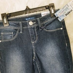 Stylish girls dark blue jeans with cuff accents